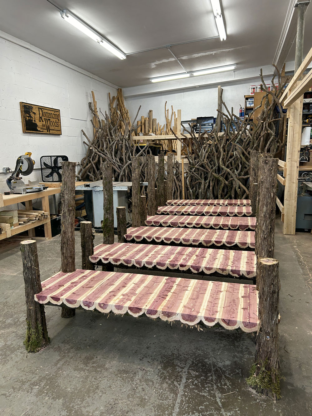Outdoor rustic garden bench built using bark-on trees and branches titled the Mohonk Putnam Bench