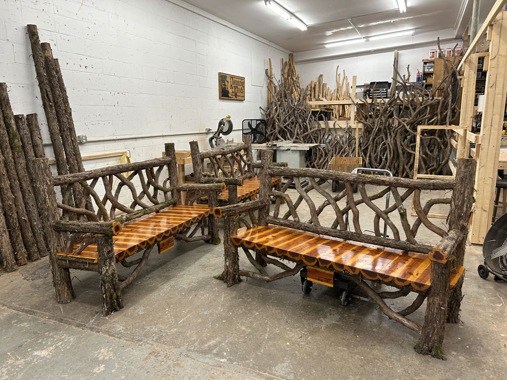 Exterior twig bench built from cedar logs titled the Mohonk Putnam Bench