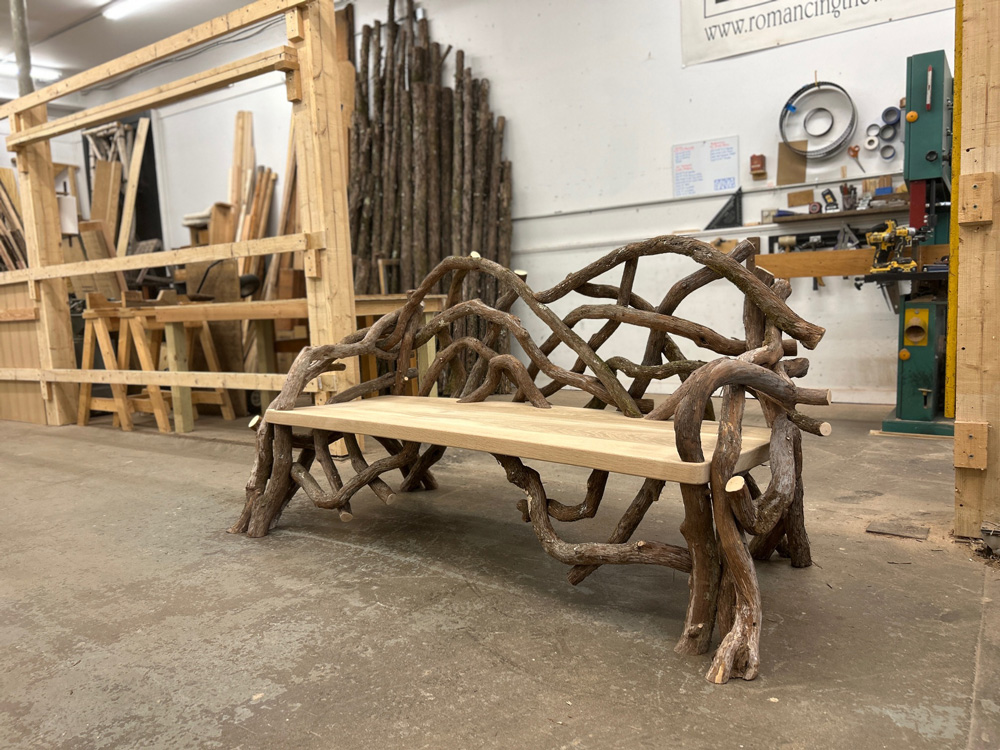 Outdoor rustic park bench built using mountain laurel trees and branches titled the Seattle Laurel Bench
