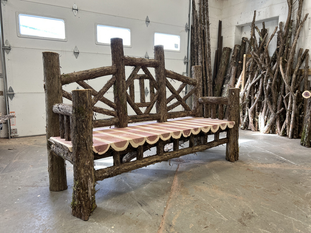 Outdoor rustic park bench built using mountain laurel trees and branches titled the Viewpoint Bench