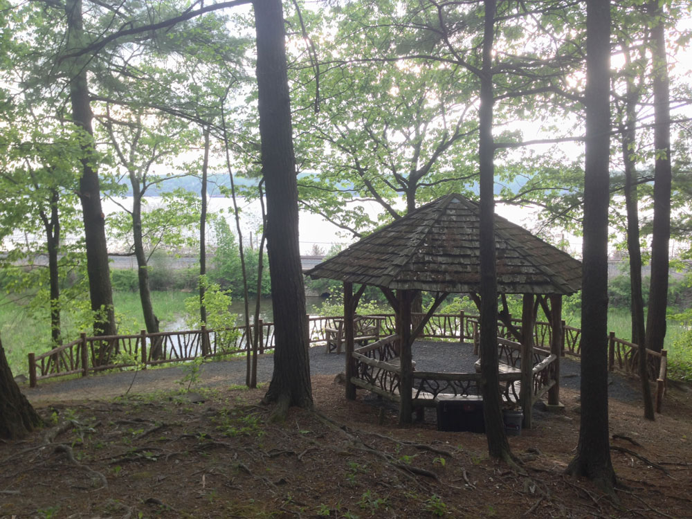 Rustic fencing built using bark-on trees and branches installed at Poet's Walk Park