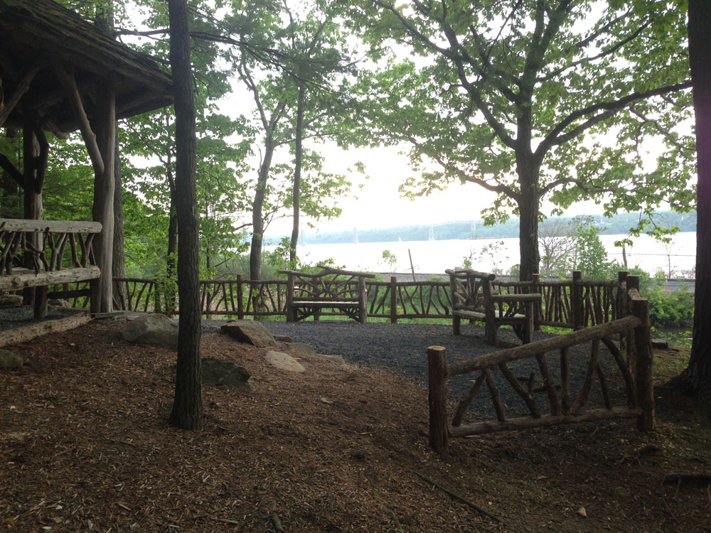 Fencing built in the rustic style using logs and branches installed at Poet's Walk Park