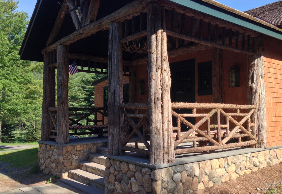 Railings built in the rustic style using logs and branches titled the Bearsville Railings