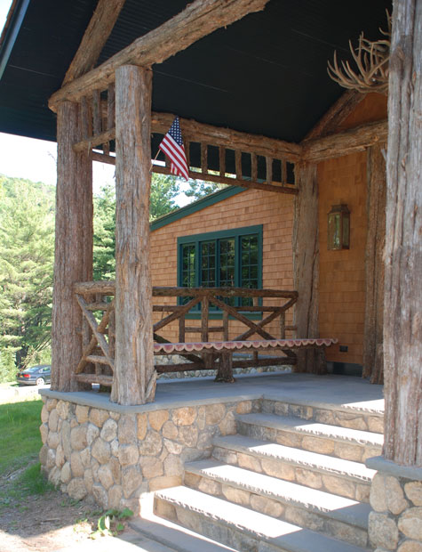 Natural wood railings built with trees and branches titled the Bearsville Benches
