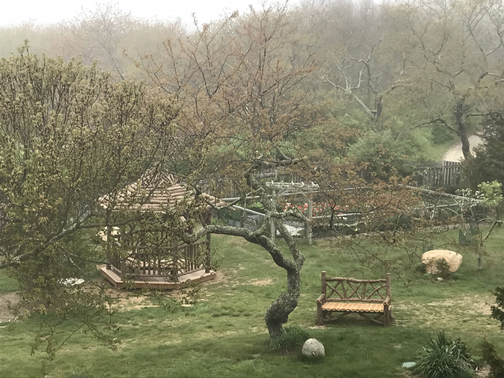Rustic gazebo built in the rustic style using logs and branches titled the Fishers Island Gazebo