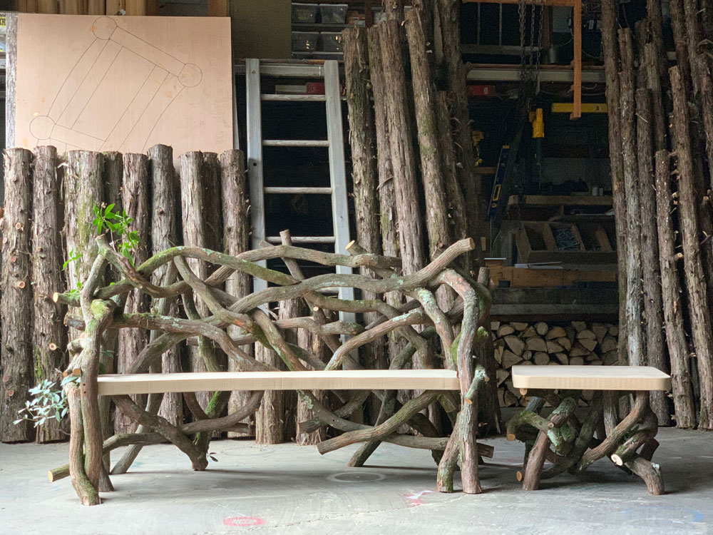 Outdoor rustic park bench built using mountain laurel trees and branches titled the Mountain Laurel Bench & Table Set