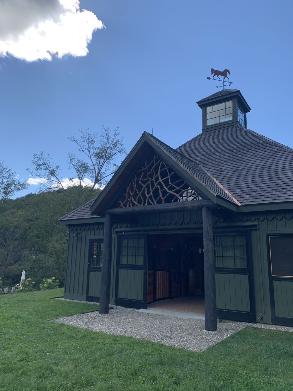 Rustic barn pediment built using mountain laurel trees and branches titled the East Meadowbrook Pediment