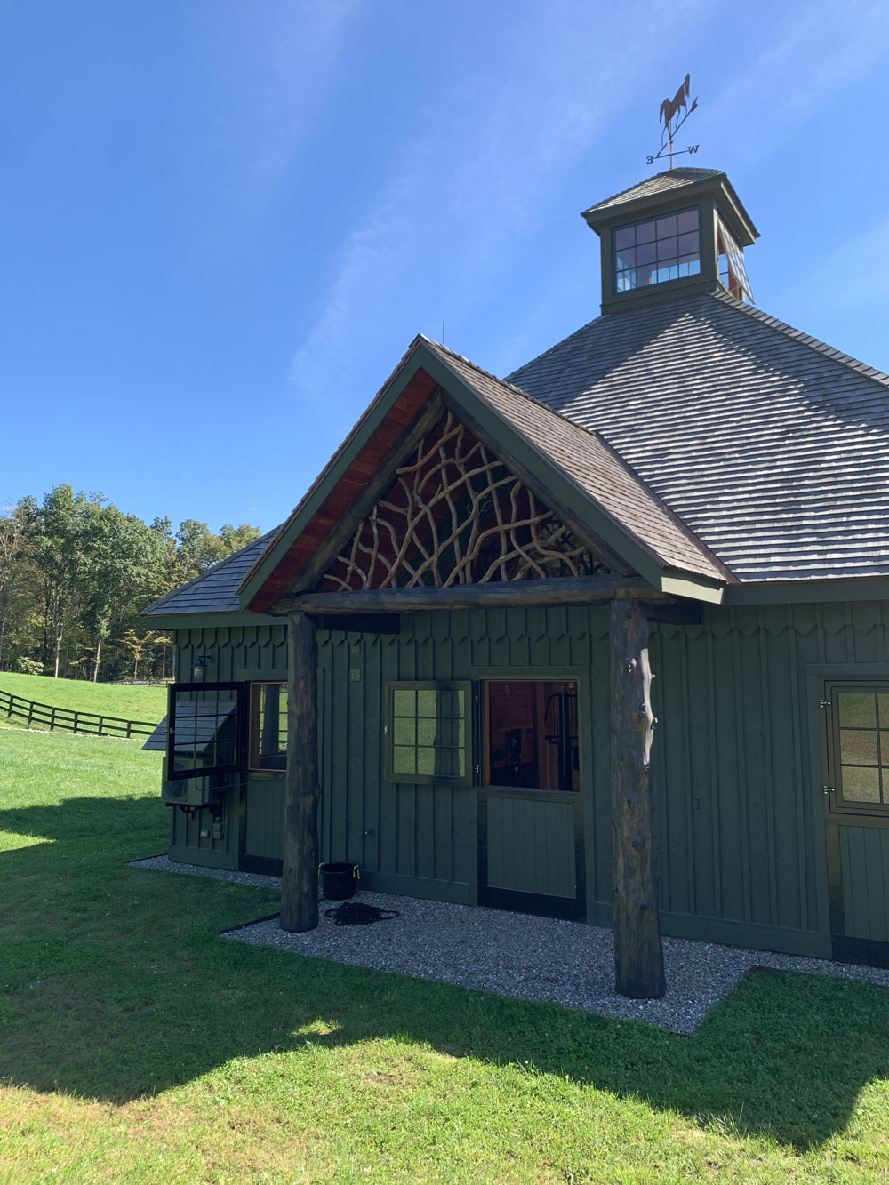 Rustic barn pediment built using mountain laurel trees and branches titled the East Meadowbrook Pediment