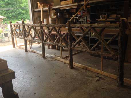 Fencing built in the rustic style using logs and branches titled the Old Chatham Fencing