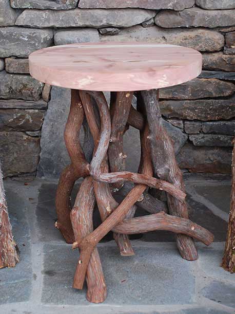 Natural wood chair built with trees and branches titled the Windham Chairs, Ottomans and Table