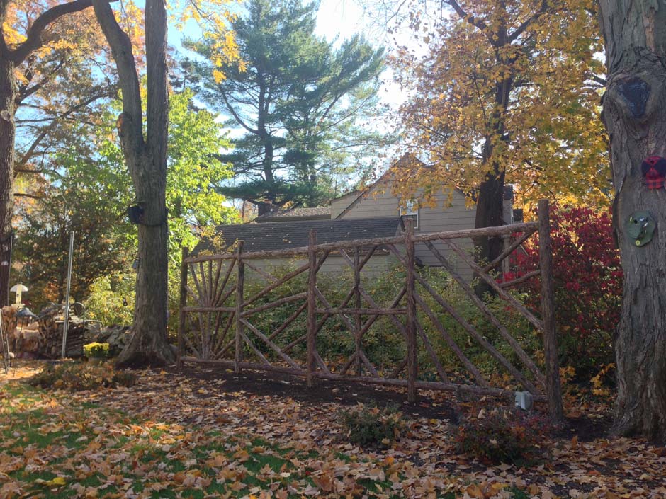 Natural wood rustic trellis built with trees and branches titled the Gabrielle