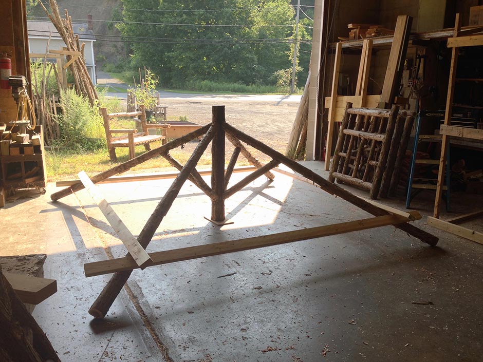 Rustic gazebo built in the rustic style using logs and branches titled the Briarcliffe Shelter