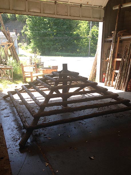 Rustic gazebo built in the rustic style using logs and branches titled the Briarcliffe Shelter