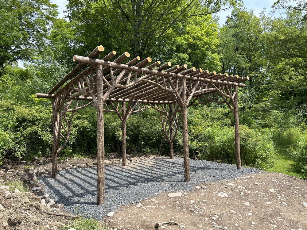 Branchwork rustic pergola constructed using natural materials titled the Preston Hollow