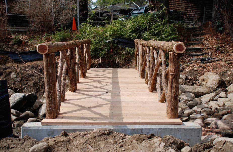 Bridge built in the rustic style using logs and branches at Sunnyside Historic Site