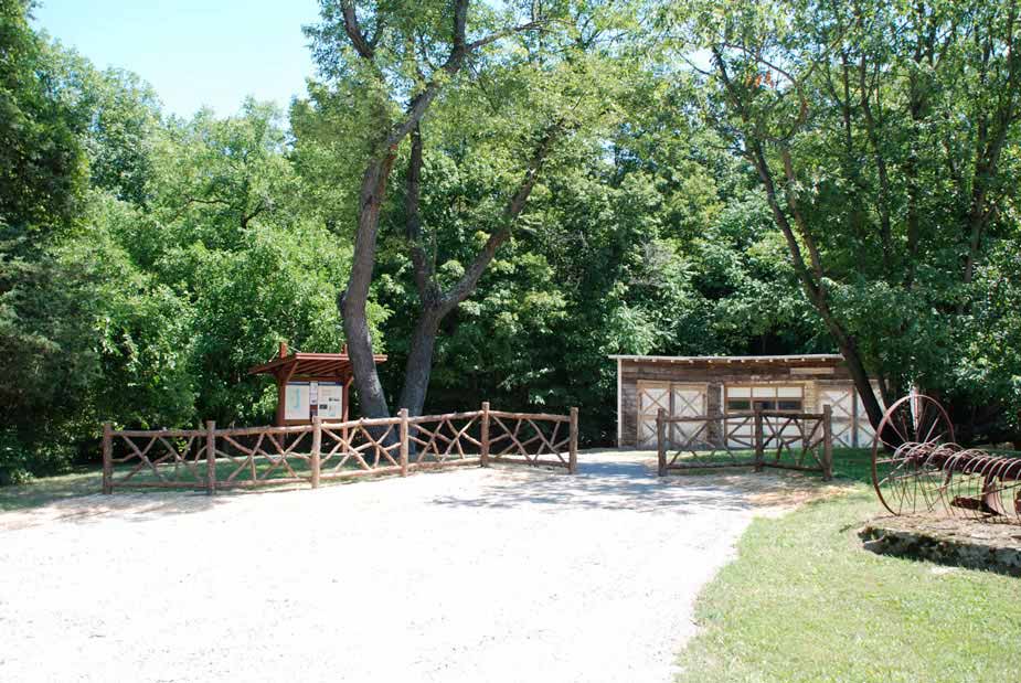 Natural wood fencing built with trees and branches titled Fencing At Falling Waters