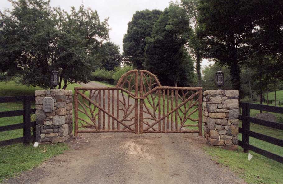 Rustic driveway gates built using bark-on trees and branches titled Norton Gates