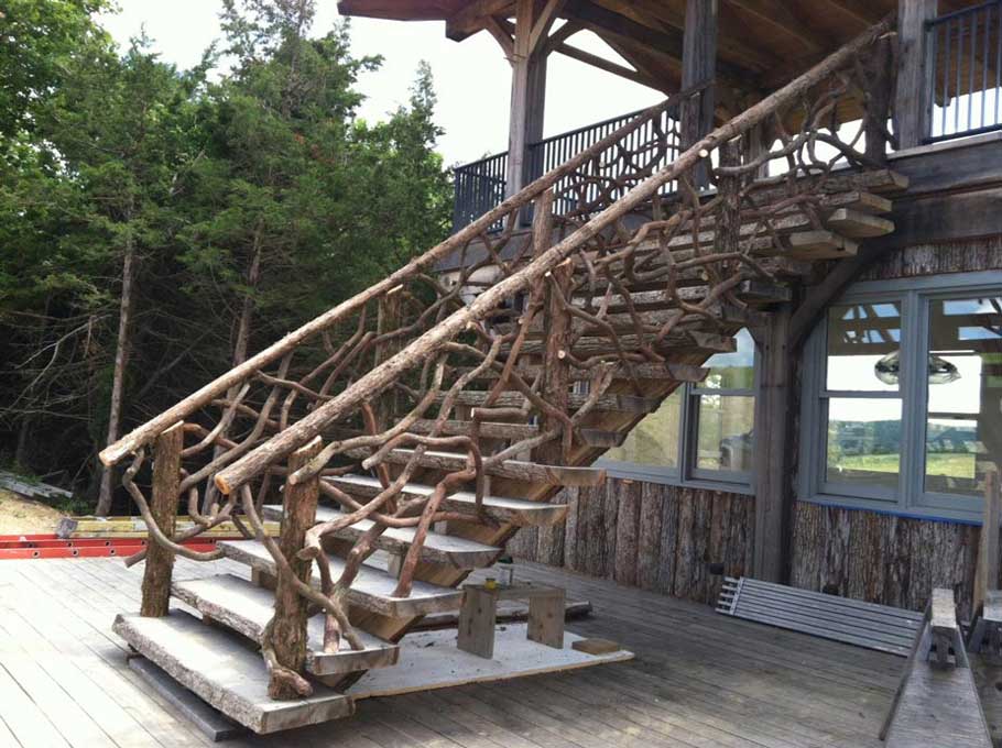 Rustic fencing built using mountain laurel trees and branches titled Wilzig Rails