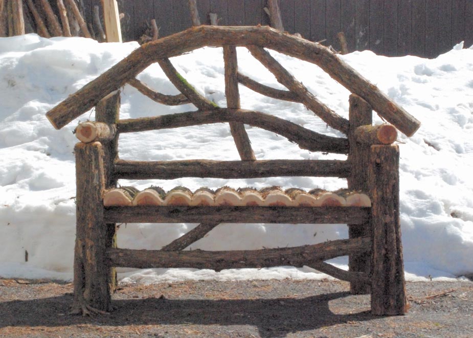 Natural wood bench built with trees and branches titled the Kehlor